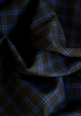 Textured wool in black tartan style with royal blue checks