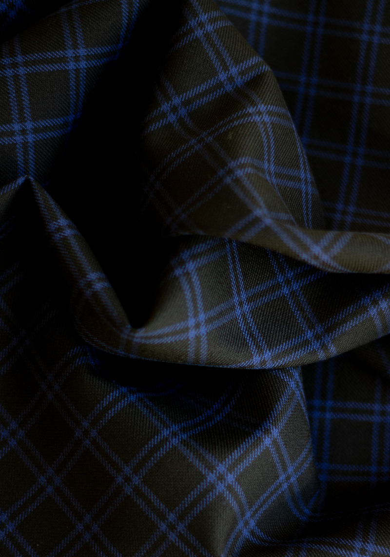 Textured wool in black tartan style with royal blue checks